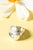 Silver ring by Sven-Erik Högberg, adorned with a large silver discus that is concave in the middle, creating a play with...