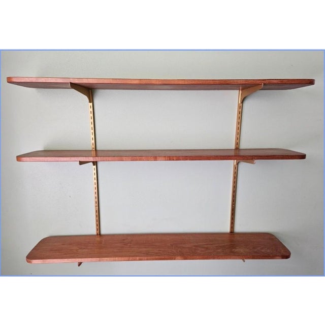 This marvelous set of 3 open shelves are created in gorgeous hardwood planks with rounded edges that has been stained a...