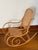 This vintage rocking chair is made of steam bent wood in a light natural finish, with scrolls along each side. The seat...