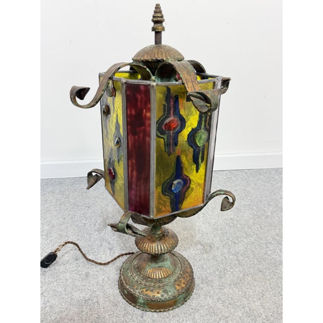 Wrought iron and multicolored glass table lamp in the "Longobard" style, 1970 4-light E14 bulb. Height 63 cm Diameter 34...