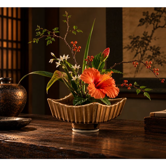 A vintage, ceramic ikebana vase or decorative bowl, with a unique footed form and brown glaze. Good condition.