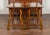 A pair of Spanish Baroque style walnut console tables from the late 19th century, with carved legs and iron stretchers....