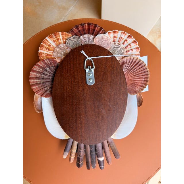 Bring natural coastal charm to your home with this locally handcrafted decorative shell wall art. Designed in a coastal...