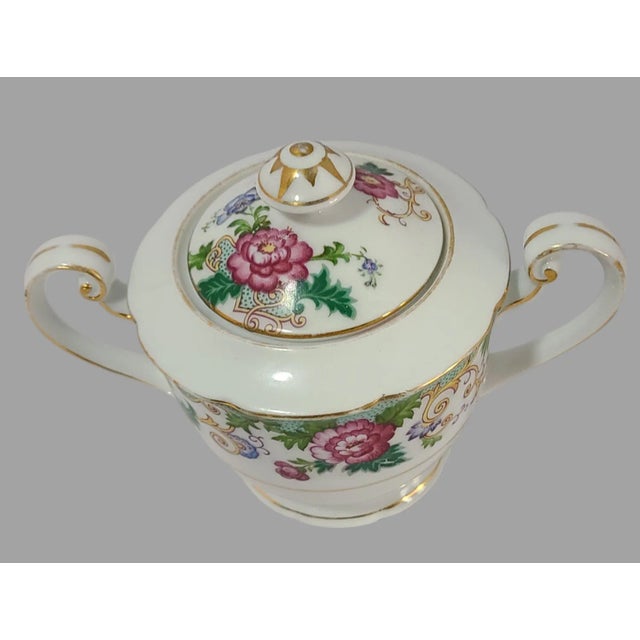 Crafted with meticulous attention to detail, this Vintage Elegant Hand Painted Floral Gilded Noritake Japan Sugar Bowl is...