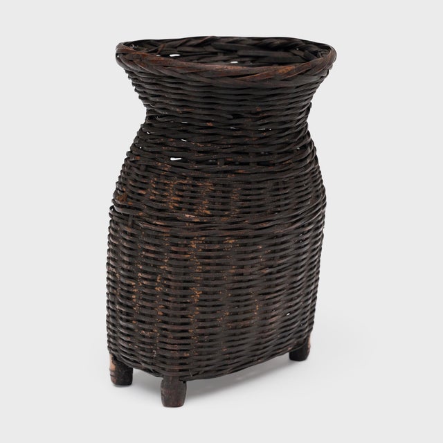 Woven with precious scale and delicate artistry, this petite bamboo basket from the early 20th century is a beautiful...