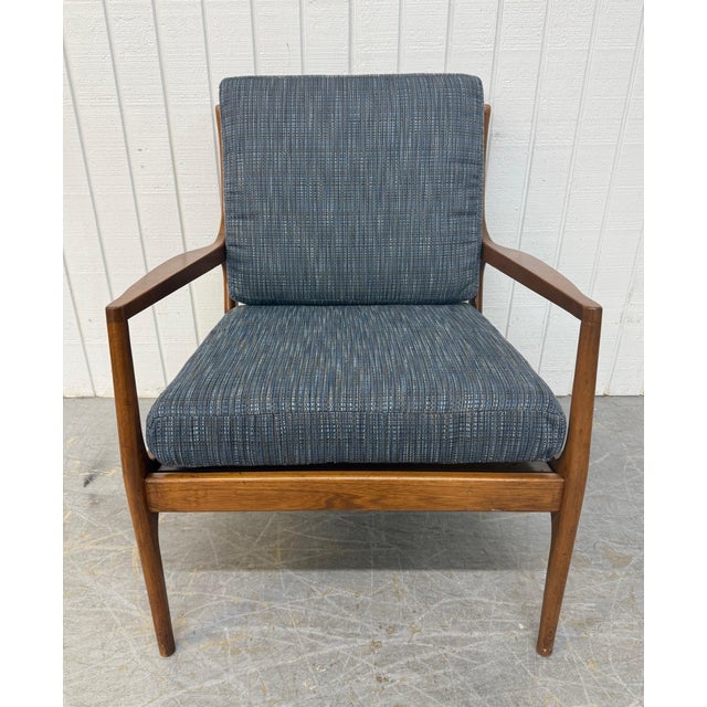 This listing is for a Mid-Century Modern Walnut Arm Chair. Featuring a straight line design, wooden frame, newly...