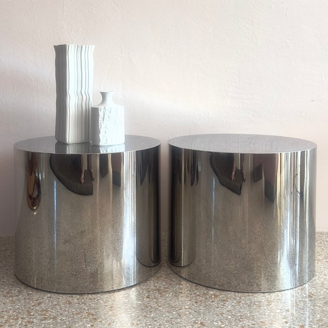 Elevate your interior with this striking pair of Mid-Century Modern polished chrome drum tables, reminiscent of iconic...