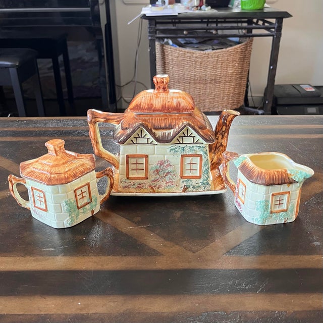 Selling this Vintage 1950s Keele Street Pottery Teapot Set. Includes Teapot, Plate, Sugar, and Creamer. This set is more...