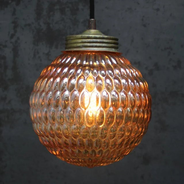 Amber texture glass pendant with brass top 2 meter black wire E27 / E26 Up to 250V (Europe/UK Standard).The wiring of this...