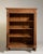 A classic oak display cabinet combining simple lines with functional storage and display space. The natural wood grain and...