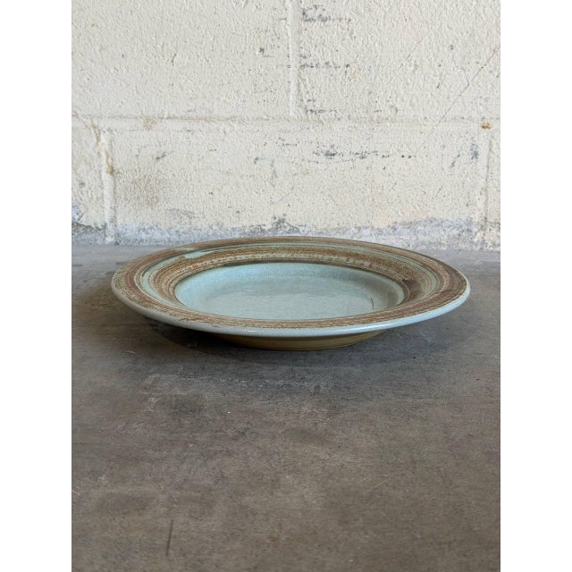 This vintage ceramic shallow basin stands out with its wide circular form and low-profile rim. The minimalist Scandinavian...