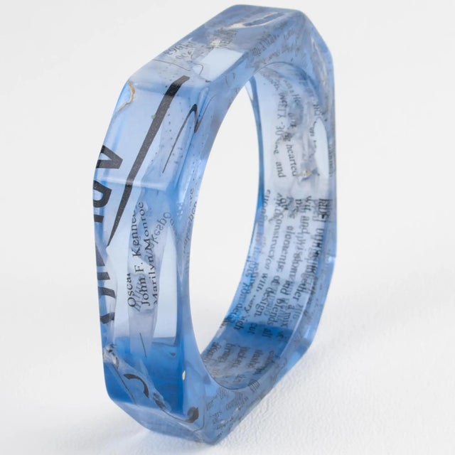 This stunning John Galliano Paris bracelet is from the 2000 Autumn-Winter "Newspaper" collection. The bangle features an...