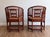Striking pair of vintage Brighton Pavilion–style bamboo and rattan armchairs featuring a rich mahogany-toned finish and...