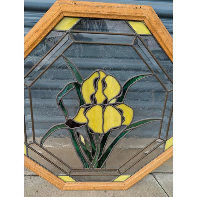 Beautiful vintage stained glass window panel featuring a striking floral design with three large golden-yellow flowers...