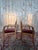 Pair of Empire-style armchairs in solid beechwood, 19th century. The scrolled armrests are carved with dolphin motifs, a...