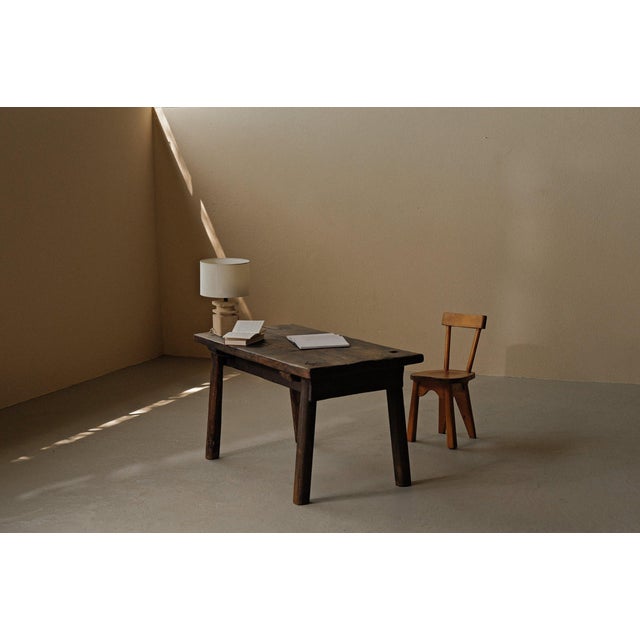 Rustic farmhouse table in solid oak, made in France around 1950. A sturdy and timeless piece that showcases the simplicity...