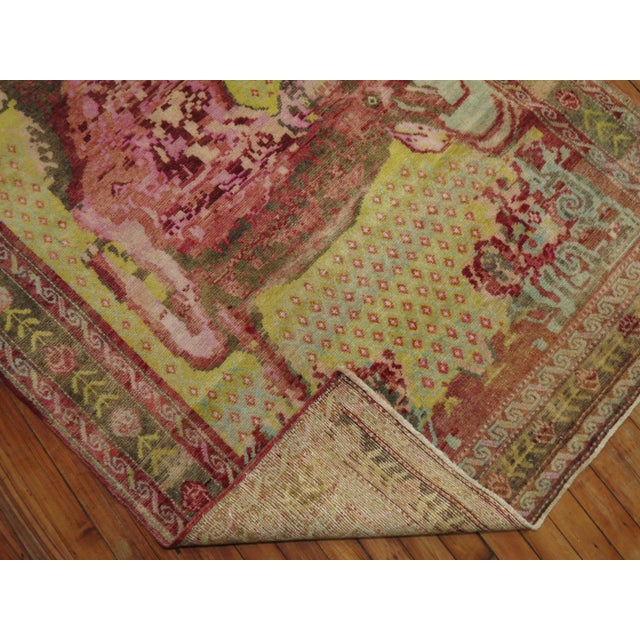 An early 20th century Russian Karabagh pictorial rug depicting a pleasant deer on a mustard yellow ground Measures: 4'1''...