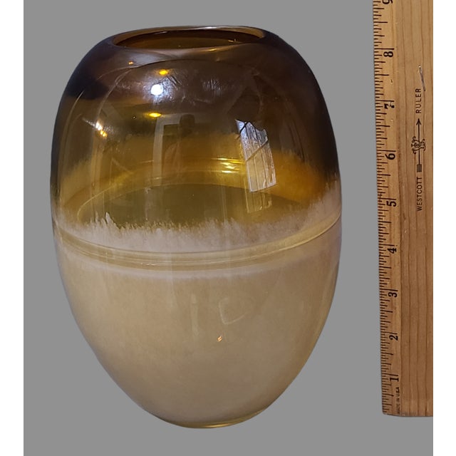 This vintage vase is a beautiful addition to any Mid-Century Modern decor. The vase is hand-blown glass with a two-tone...