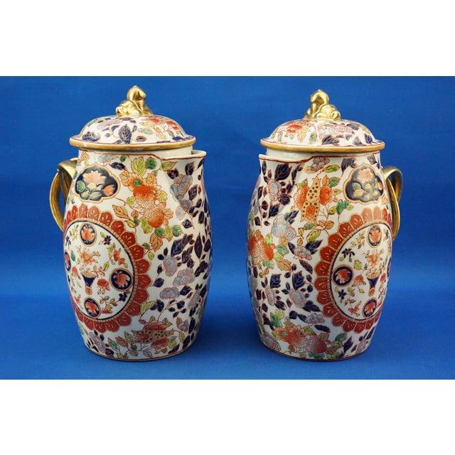 Item : A magnificent pair of large Japanese lidded jugs, crafted from the finest vitrified hard-paste porcelain, both...