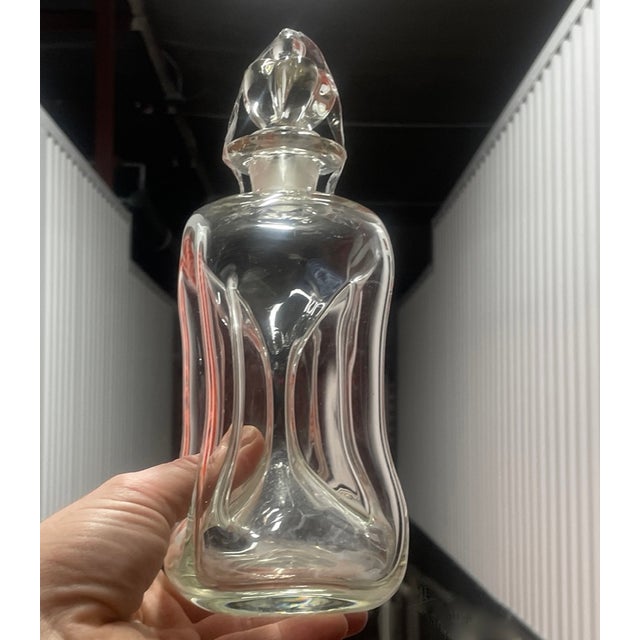 This is a definitive example of mid-century Danish glasscraft: the "Kluk Kluk" (Gurgle) decanter, designed by Jacob E....
