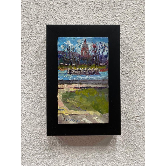 This oil painting captures a serene view of Ferril Lake City Park, showcasing a harmonious blend of vibrant colors and...