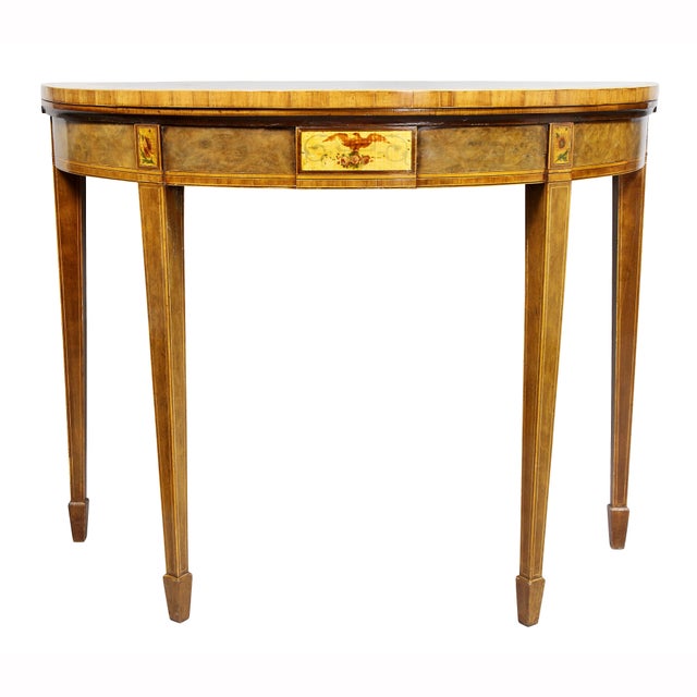 With highly figured hinged tops and borders painted with scrolling poppies, baize lined interior, frieze with central...