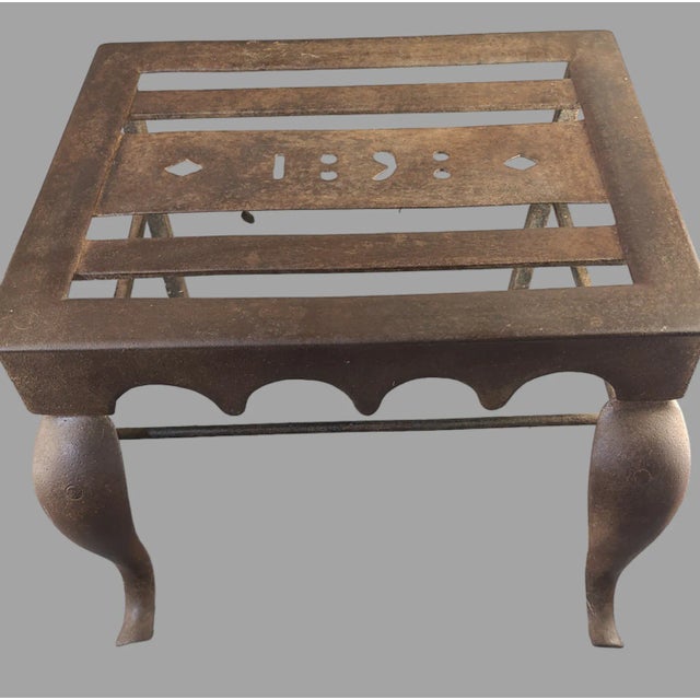 This antique wrought iron fireplace hearth trivet stool bench stand is a unique piece that dates back to 1898. It is made...
