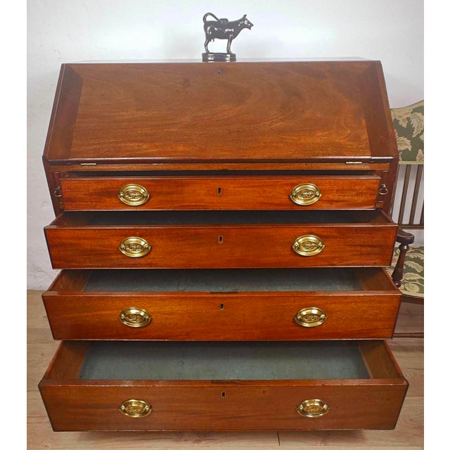 This is a gorgeous George III Writing Bureau Desk that exudes a wonderful antique style to the living room or office home...