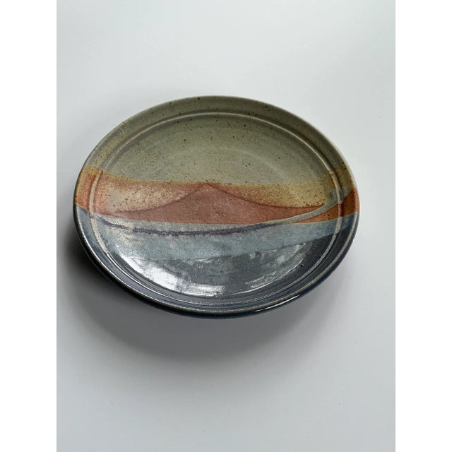 Handmade Blue and Orange Pottery Wall Plate, a beautiful addition to a gallery wall or on an easel in the bookcase....