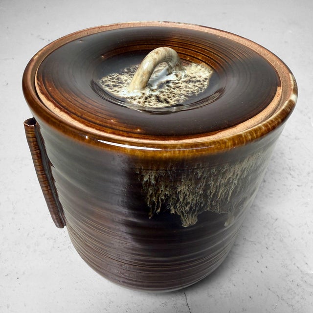 Characterful Japanese mizusashi – a water jar used in the tea ceremony – from Takatori. The jar is made of stoneware with...