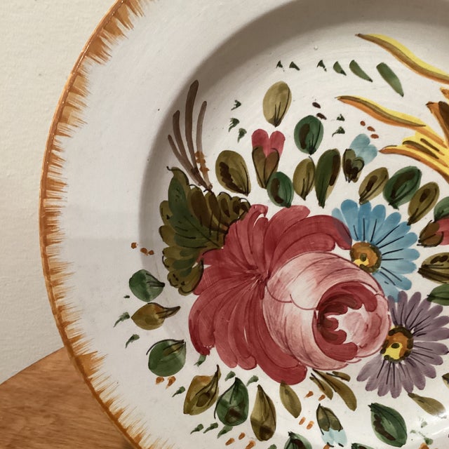 Vintage Italian Artisan Ceramics Hand Painted Majolica Wall Plate Signed Mota Este An overall floral decoration with a...
