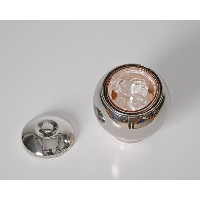 Stunning mid-century chrome metal ice bucket. This elegant piece was designed by Aldo Tura for Macabo in Italy in the...