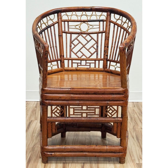 Stunning vintage Chinoiserie Chippendale Brighton Pavilion Style rattan chair with split reed seat. Features a unique...