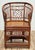 Stunning vintage Chinoiserie Chippendale Brighton Pavilion Style rattan chair with split reed seat. Features a unique...