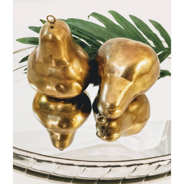 Mid-Century Modern Brass pair of figural pears. Amazing sculptural design in these two pieces of fruit. Hollow with a...