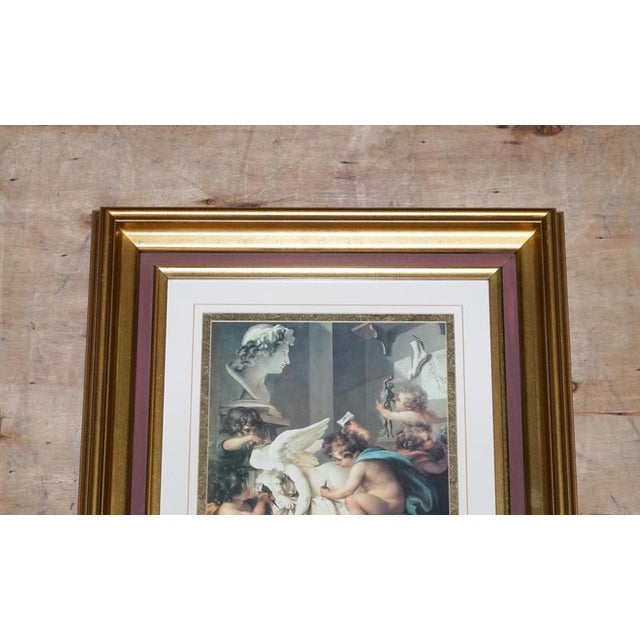 Antiques of London A decorative vintage Renaissance-style print titled “Cherubs Sculpting an Angel”, inspired by classical...