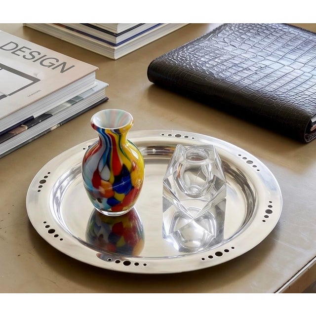 A quintessential example of the "Machine Age" revival, this 14-inch serving platter was designed by Kris Fiocca during the...