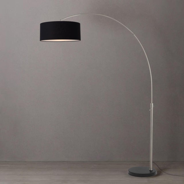 The Float Arc Lamp is a modern masterpiece designed by Peter Morelli in 1960, featuring a sweeping arc silhouette that...