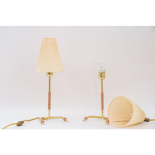 2 rare Rupert Nikoll table lamp vienna around 1950s. Brass polished and stove enameled. Fabric shade is replaced ( new)....