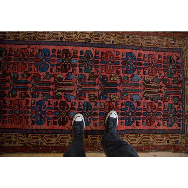 :: Covered field in ram's horn stylized guls with unidirectional germinating plants in a single column formation adorned...