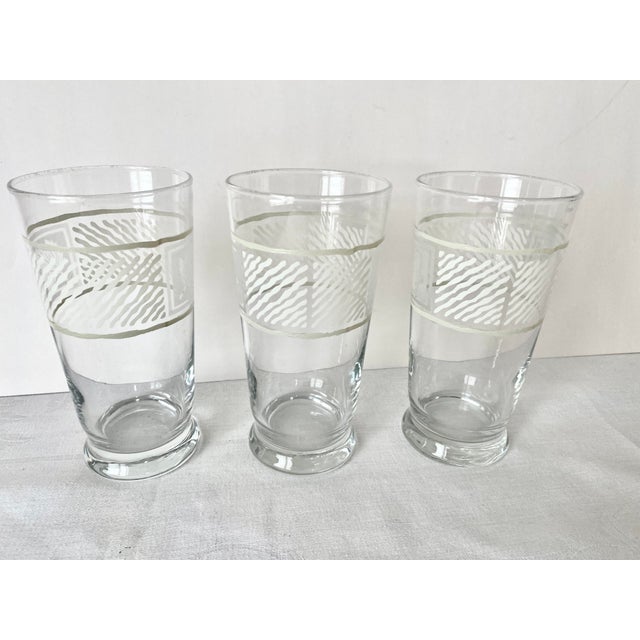 Late 20th Century set of three iced tea/water glasses in the discontinued Sierra pattern by Pfaltzgraff. These highly...