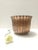 Made in Italy, 1950s. This elegant cachepot, which can also be used as a centerpiece or a vase, is made in embossed copper...