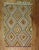A vintage geometric Turkish Kilim accent-size rug from the mid-20th century. Measures: 5' x 7'5''.