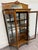 This is a stunning antique American Victorian or Edwardian quarter sawn tiger oak curved glass china cabinet or curio,...