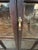 Classic vintage Mission style dark wood & glass display cabinet having panes around sides and back to allow viewing...