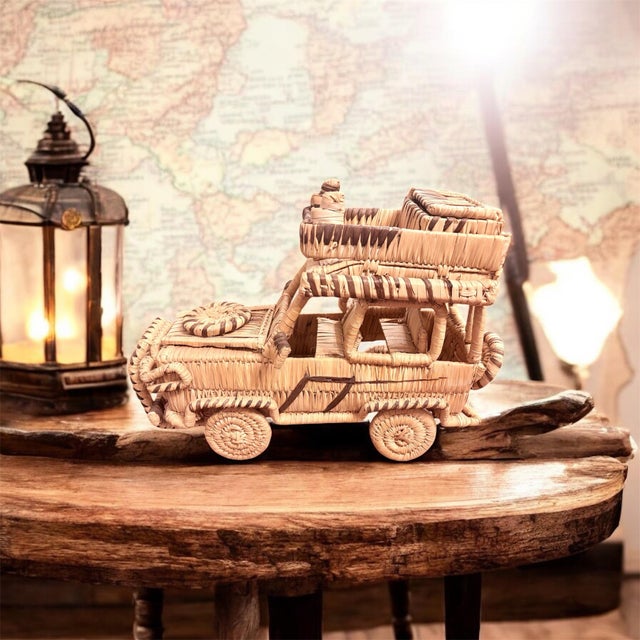 Amazing large Jeep made of Rattan with working wheels and many details. You can open the hood and you can open the case on...