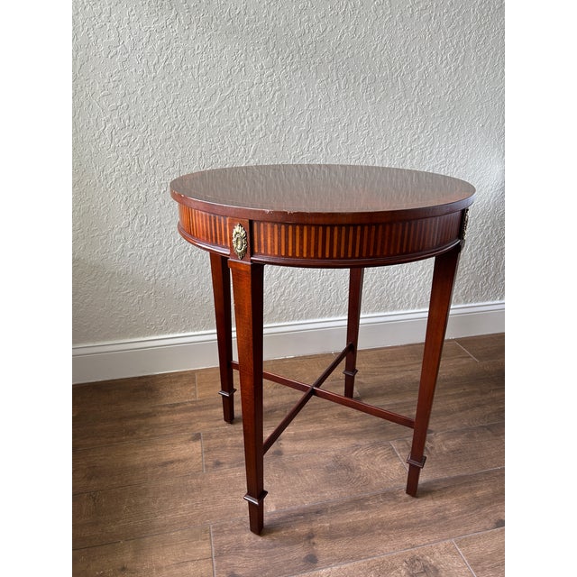 Baker Furniture tea/side table. Circa 1980s. Neoclassical, Louis XVI, French Regency, Traditional Mahogany and Satinwood...