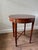 Baker Furniture tea/side table. Circa 1980s. Neoclassical, Louis XVI, French Regency, Traditional Mahogany and Satinwood...