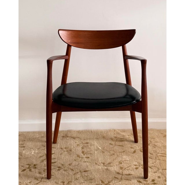 This armchair demonstrates the refined proportions and sculptural clarity associated with Østergaard’s work, with a gently...