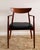 This armchair demonstrates the refined proportions and sculptural clarity associated with Østergaard’s work, with a gently...